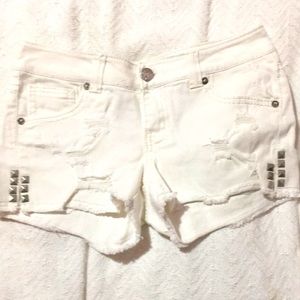 White ripped shorts